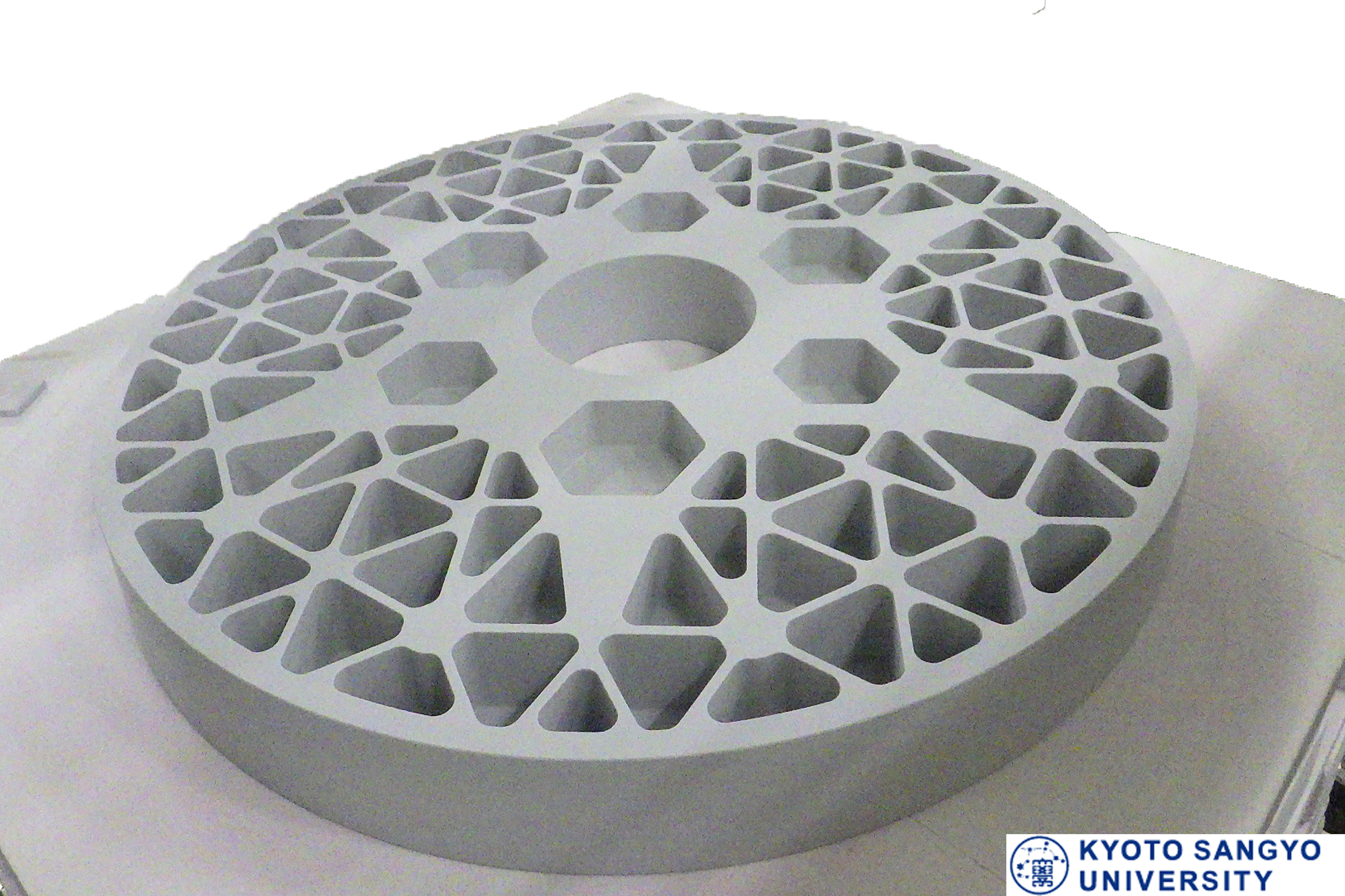 Large Fine Cordierite mirror, 1.3 meters in diameter after sintering, showcasing Kyocera's manufacturing capability 