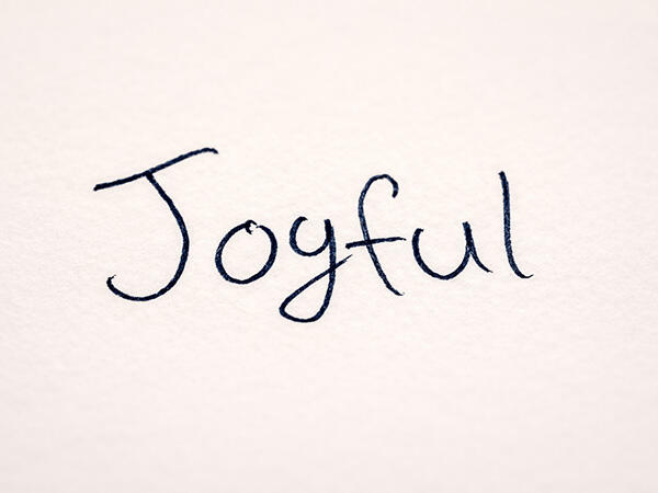The handwritten word 'Joyful,' chosen by Geli