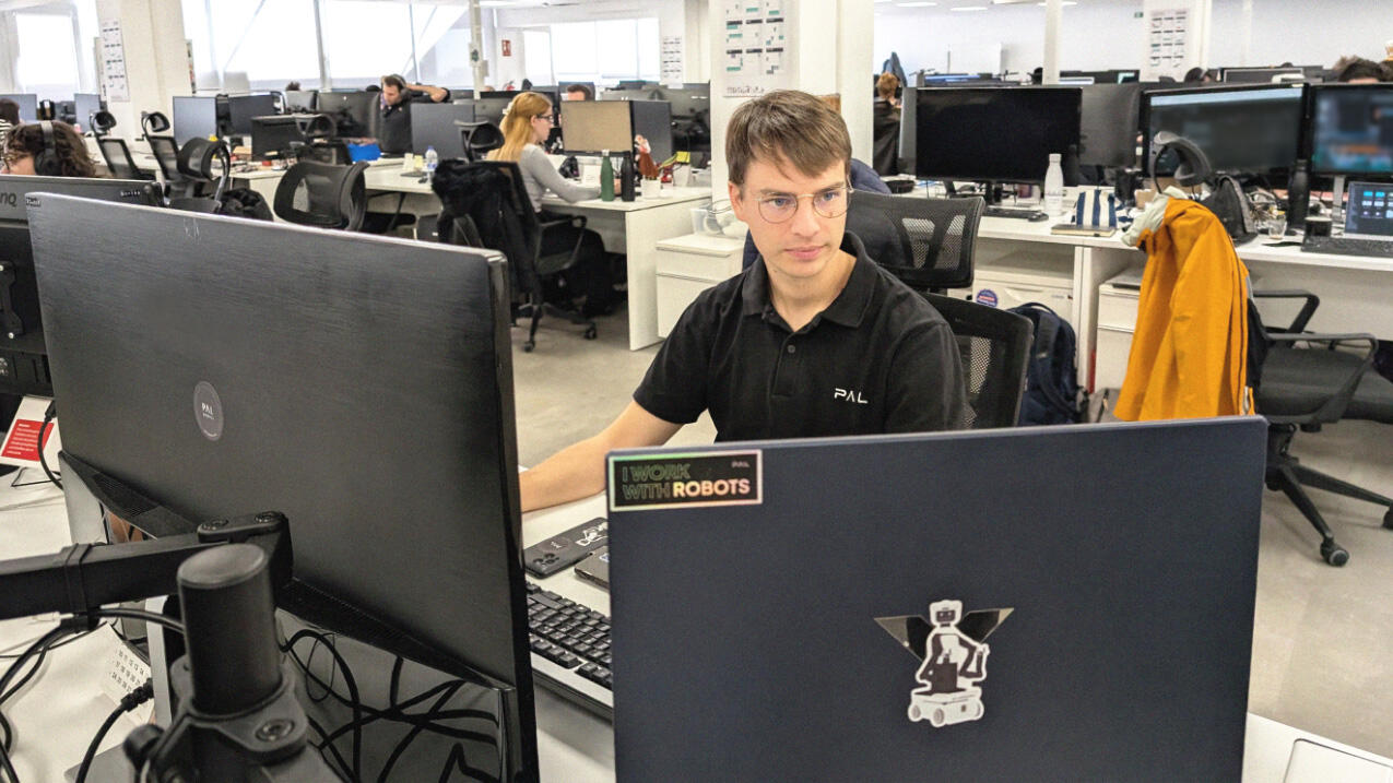 Thomas working in an office