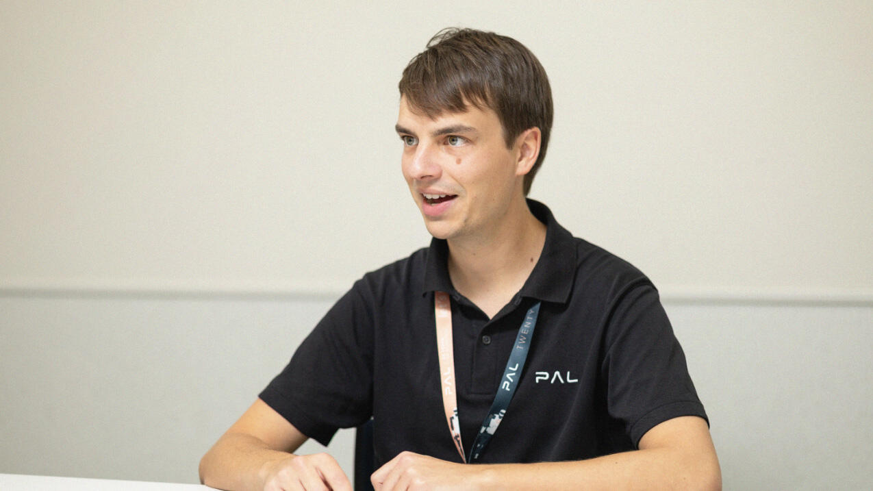 Thomas speaking enthusiastically to the interviewer